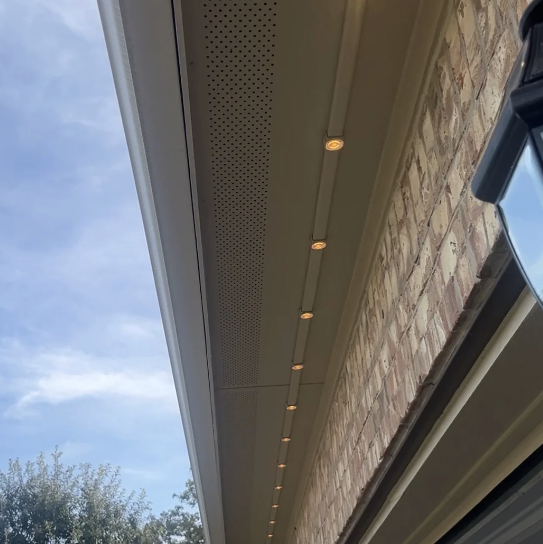 Permanent roofline LED lights with hidden track under soffit