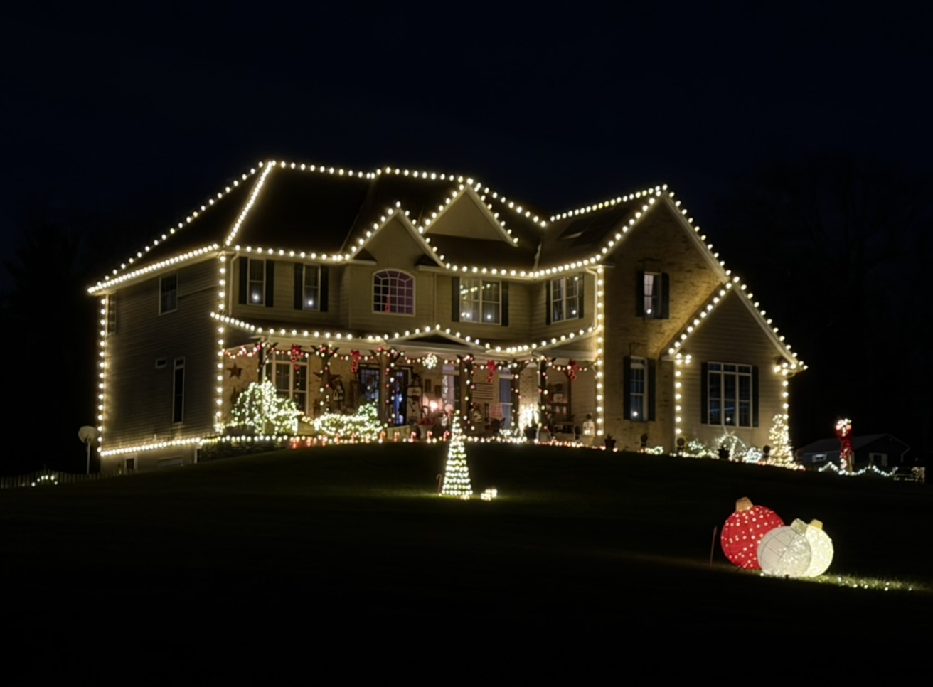 Holiday roofline lighting installed by Custom Lighting of Maryland